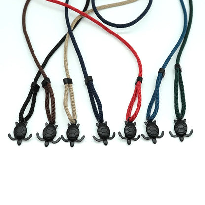 Sea turtle charm rope bracelets shown together in seven cord colors