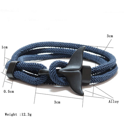 Diagram showing the whale tail charm dimensions and 12.3g weight of a navy rope bracelet