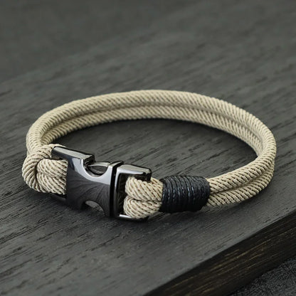 Khaki double-strand rope bracelet with a gunmetal spring-loaded buckle clasp