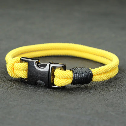 Yellow double-strand rope bracelet with a gunmetal spring-loaded buckle clasp