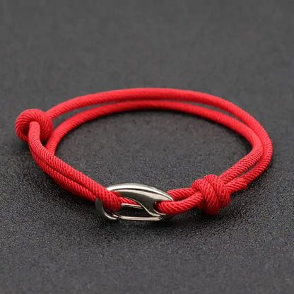 Red nylon rope bracelet double-wrapped with a curved metal hook clasp