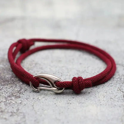 Wine-colored nylon rope bracelet double-wrapped with a curved metal hook clasp