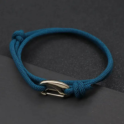 Peacock blue nylon rope bracelet double-wrapped with a curved metal hook clasp