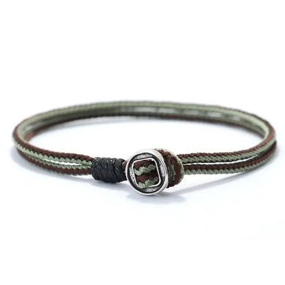 Brown and black two-tone woven cord bracelet with a silver toggle bead
