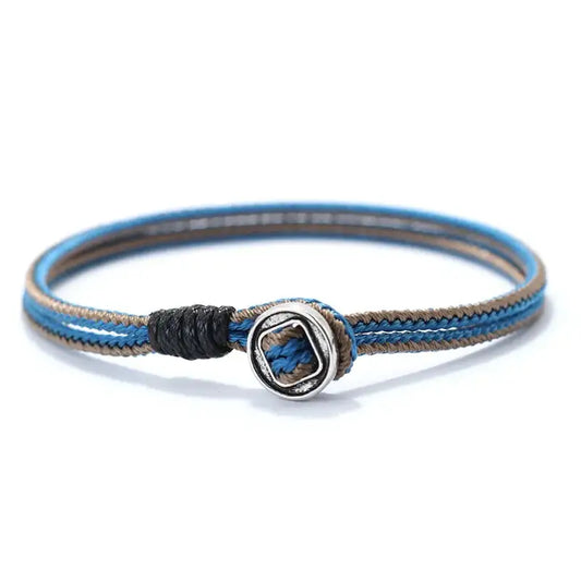 Blue and black two-tone woven cord bracelet with a silver toggle bead