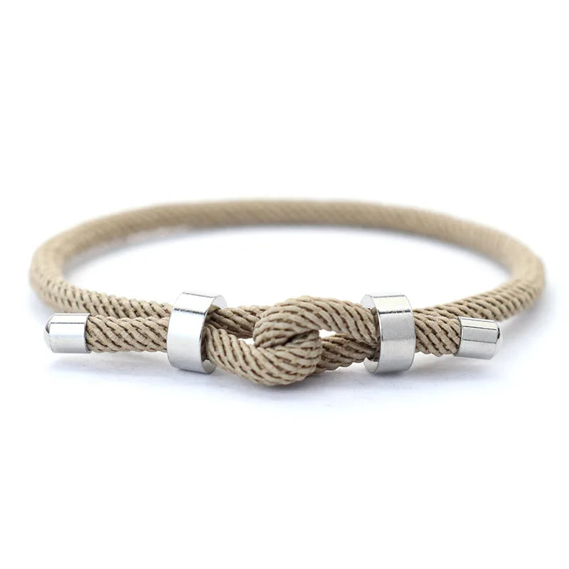 Khaki nylon cord bracelet with stainless steel end caps and a sliding knot