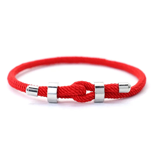 Red nylon cord bracelet with stainless steel end caps and a sliding knot closure