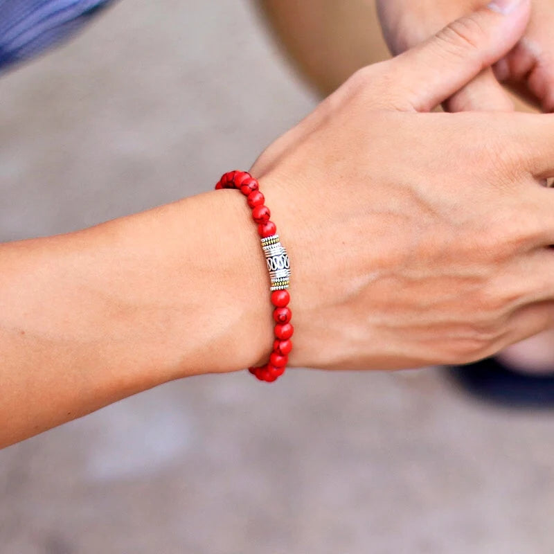 Mantra Tibetan Bead Bracelet in red turquoise worn on the wrist