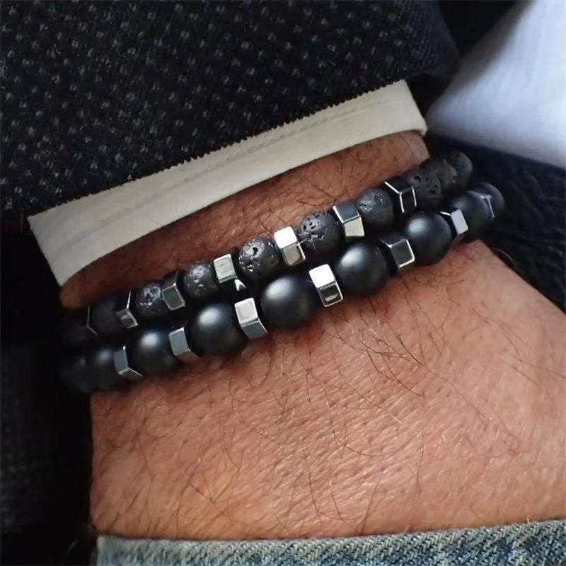 Duality bead bracelet set worn on the wrist, layered lava stone and black onyx beads