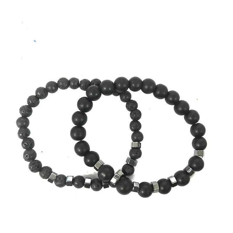 Close-up of lava stone and matte black onyx beads with cube-cut hematite spacers