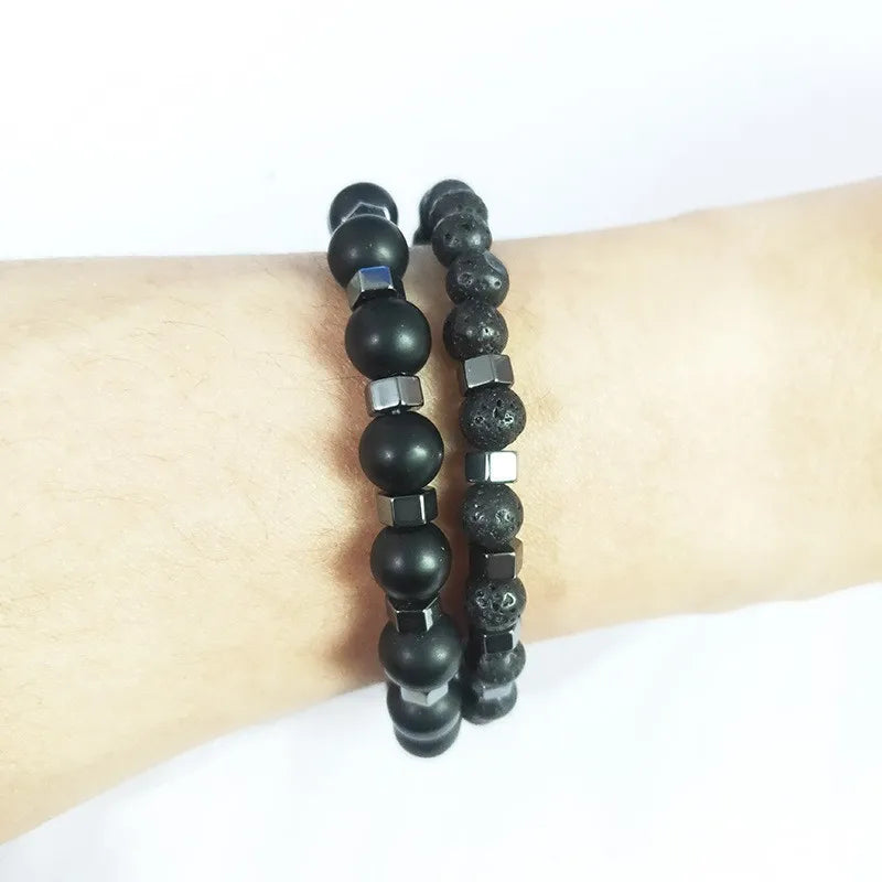 Duality bracelet set layered together showing lava and onyx bead contrast