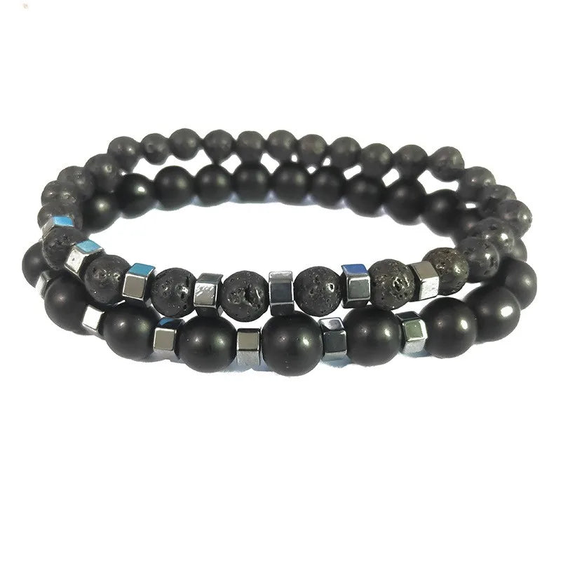 Lava rock and matte onyx beads with polished hematite spacers, angled studio shot