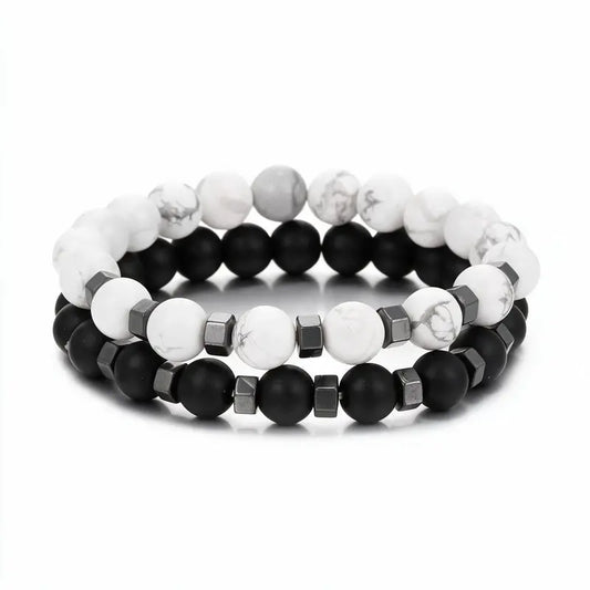 White howlite and matte black onyx bead bracelet set with hematite spacers, product photo on white background