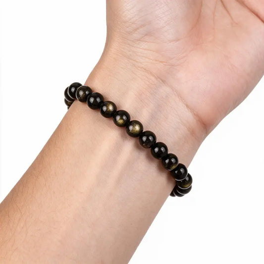 Eclipse Golden Obsidian Bead Bracelet worn on wrist
