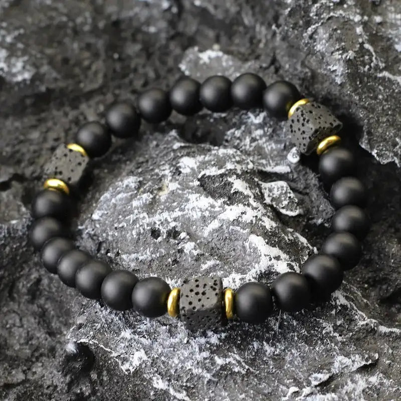 Matte onyx bead bracelet with gold spacer cubes