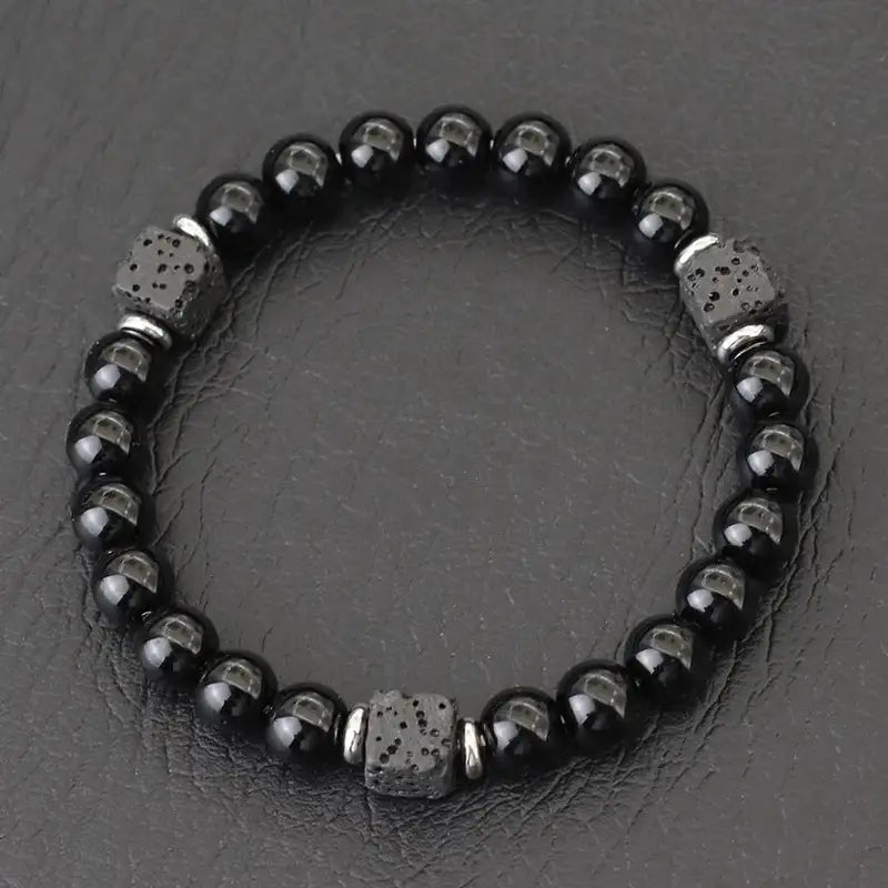 Glossy obsidian bead bracelet with silver spacer cubes