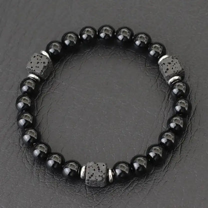 Glossy obsidian bead bracelet with silver spacer cubes
