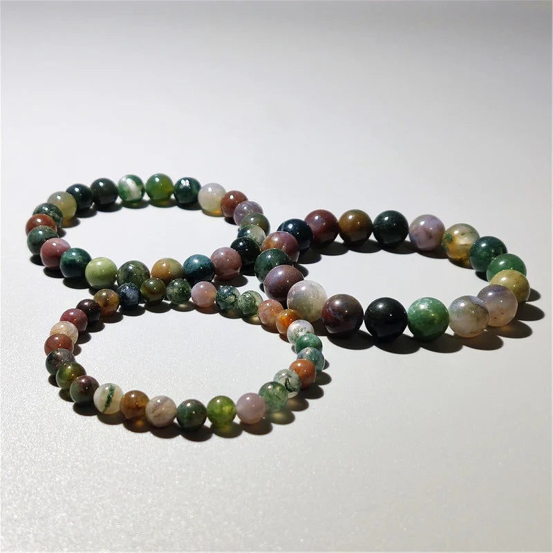 Indian agate bead bracelets coiled together, multicolor natural stone detail