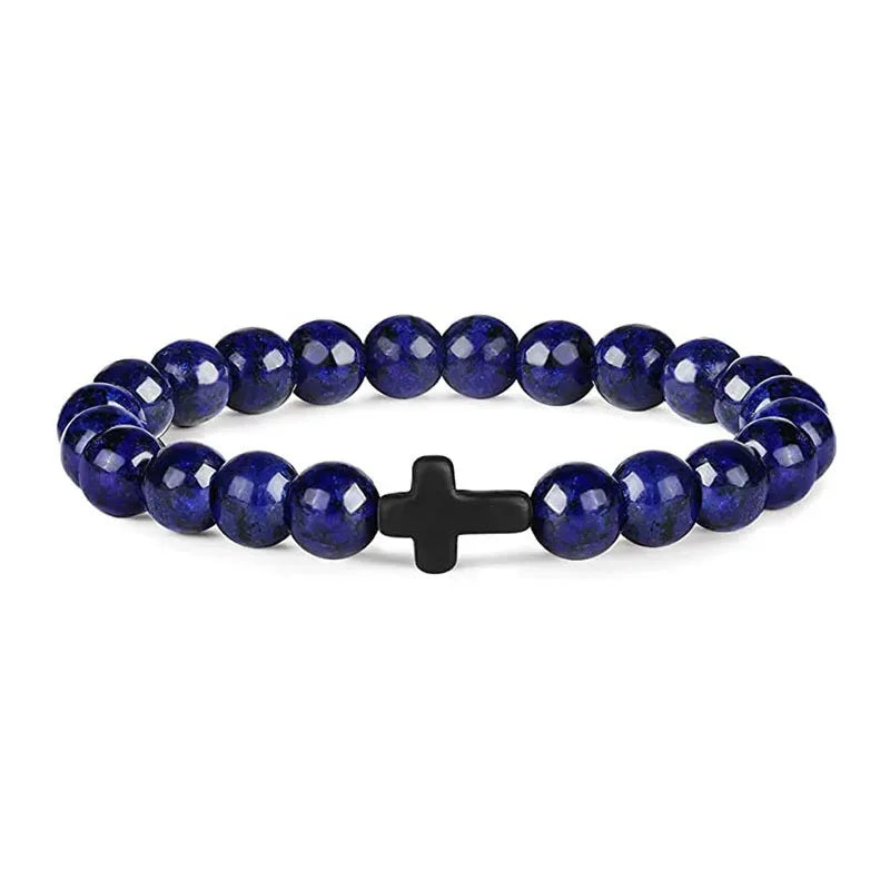 Blue lapis bead bracelet with a small black cross bead