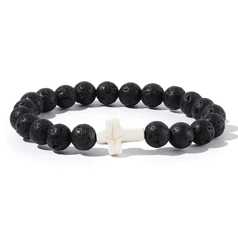Black lava stone bead bracelet with a contrasting white cross bead