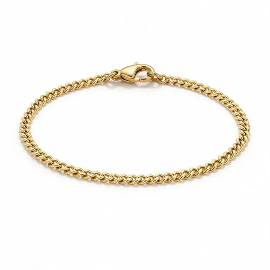 Astor gold slim Cuban curb chain bracelet, product photo on white background.