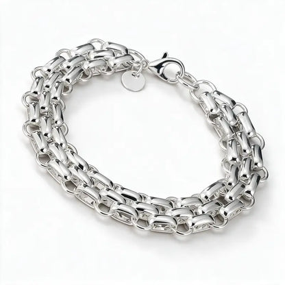 925 sterling silver chunky woven box-link chain bracelet with a round tag, product photo on white background