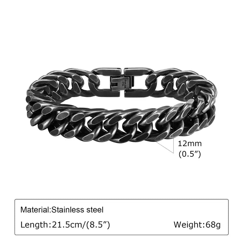 12mm oxidized gunmetal stainless steel Cuban double-curb link bracelet, 21.5cm, coiled flat on a white background