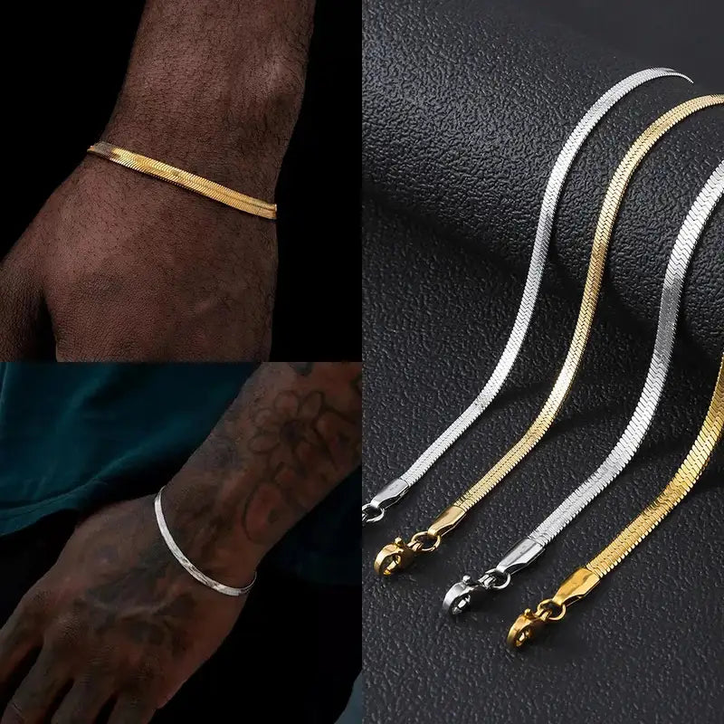 Gold and silver flat herringbone chain bracelets worn on the wrist and shown in multiple widths on a display stand