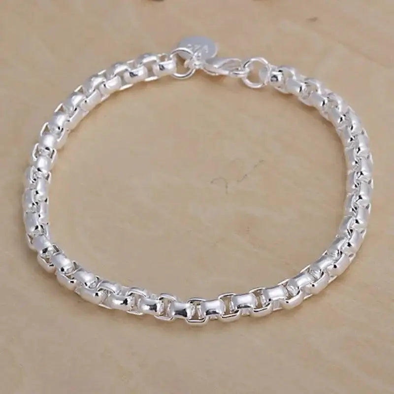 6mm polished stainless steel rounded box-link rolo chain bracelet with a 925-style tag near the clasp