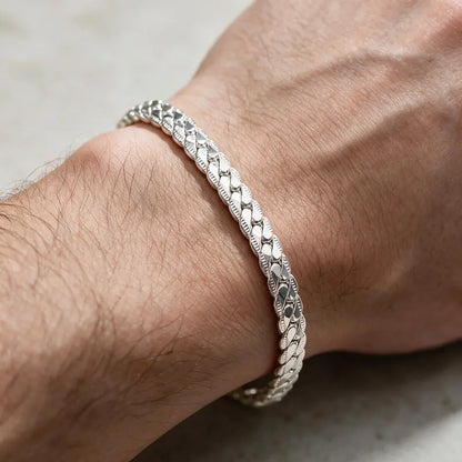 Silver scaled snake chain bracelet worn on the wrist