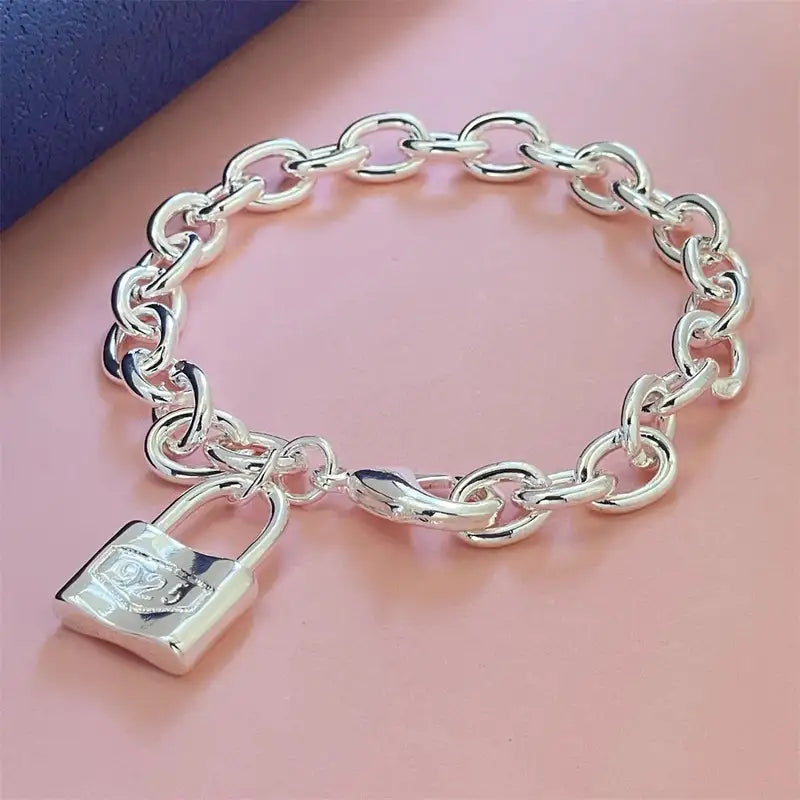 925 sterling silver bold oval cable-link chain bracelet with a padlock charm