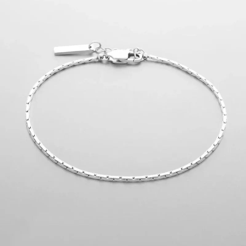 Premium gold wire bracelet featuring a secure lobster-claw clasp and adjustable extension chain.