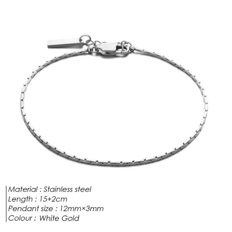 White gold-tone wire chain bracelet laid flat on a white background, labeled Stainless steel, 15+2cm length, 12mm×3mm pendant size, White Gold colour.