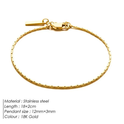 Gold wire chain bracelet laid flat on a white background, labeled Stainless steel, 18+2cm length, 12mm×3mm pendant size, 18K Gold colour.