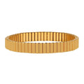 Gold flexible stretch bracelet with rectangular link segments, standing upright on a plain white background