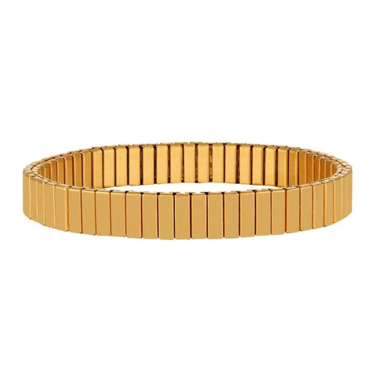 Gold flexible stretch bracelet with rectangular link segments, standing upright on a plain white background