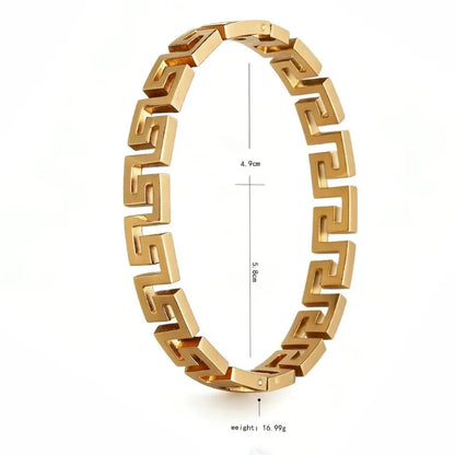 Gold Greek key link bangle bracelet shown at an angle with diameter measurements (4.9cm by 5.8cm) and weight (16.99g) labelled
