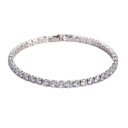Tennis bracelet with clear cubic zirconia stones in a silver setting, on a plain white background