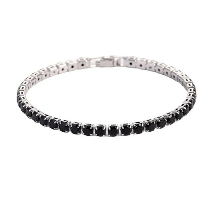 Tennis bracelet with black onyx-coloured stones in a silver setting, on a plain white background