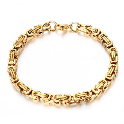 Gold Byzantine box-chain bracelet laid flat in a circle on a plain white background.