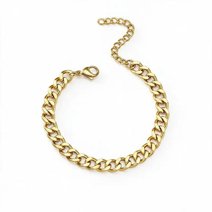 Gold Cuban chain bracelet with lobster clasp and extension chain, on a plain white background.