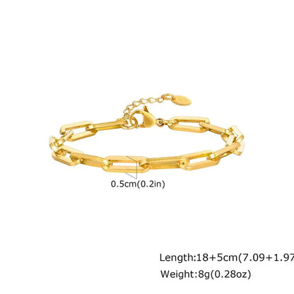 Thin gold box chain bracelet with a small rectangular bar charm, dimensions labelled: 21+5cm length, 7g weight