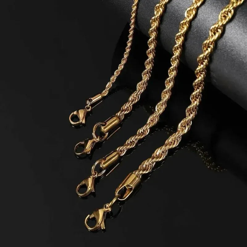 Close-up of four gold twisted rope chain bracelets' clasps of different widths, draped over a black display stand.