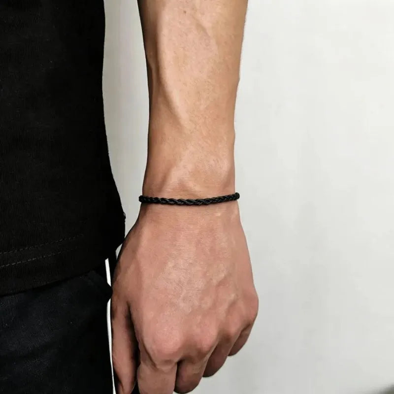 Classic twisted rope bracelet crafted from stainless steel with a refined polished gold appearance.