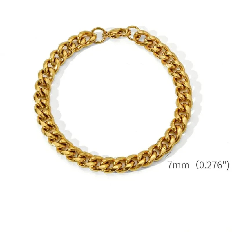 Gold Cuban link bracelet laid flat in a circle on a white background, labeled with a 7mm (0.276") link width.