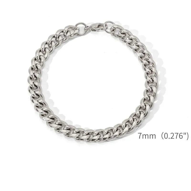 Silver-tone Cuban link bracelet laid flat in a circle on a white background, labeled with a 7mm (0.276") link width.