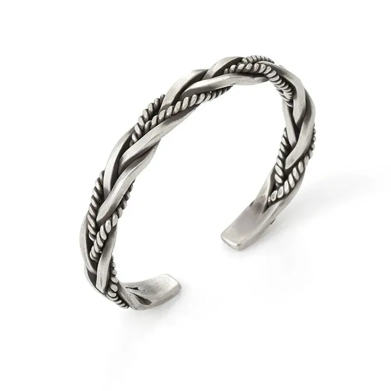 Silver open-cuff twisted bracelet shown from another angle on a plain white background.