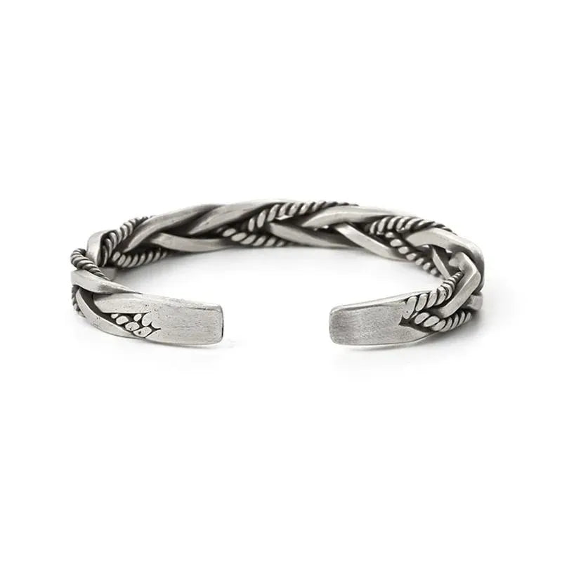 Silver open-cuff twisted bracelet shown front-facing on a plain white background.
