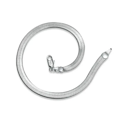 Silver flat blade chain bracelet coiled loosely on a white background, with a '925' stamp visible on the clasp.