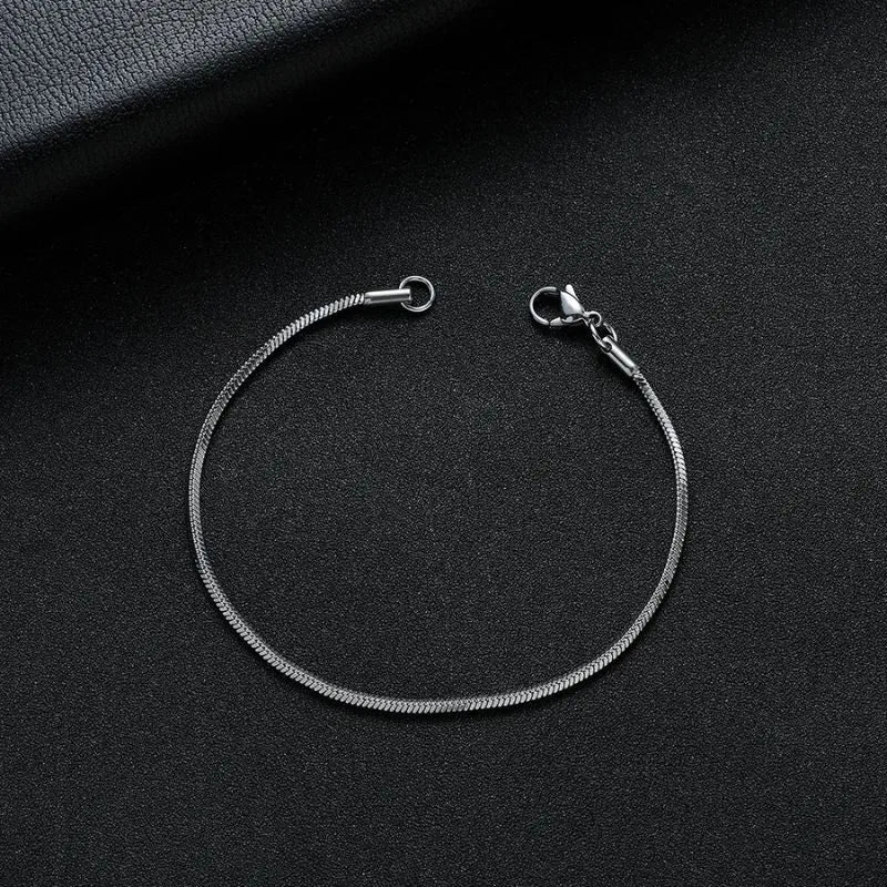 Essential Snake Chain Bracelet showcasing a minimalist sterling silver design with a secure lobster clasp for everyday wear.